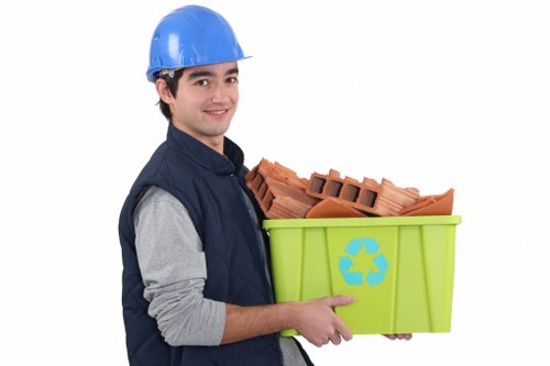Workers handling rubbish removal equipment in Roehampton with ethical compliance focus