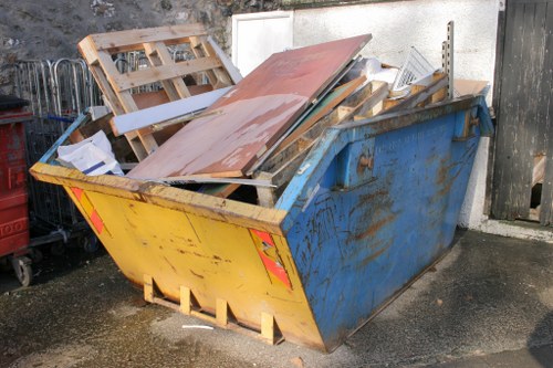 Rubbish removal team handling household waste in Roehampton