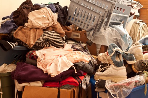 Local clearance team handling bulky items during house clearance in Roehampton